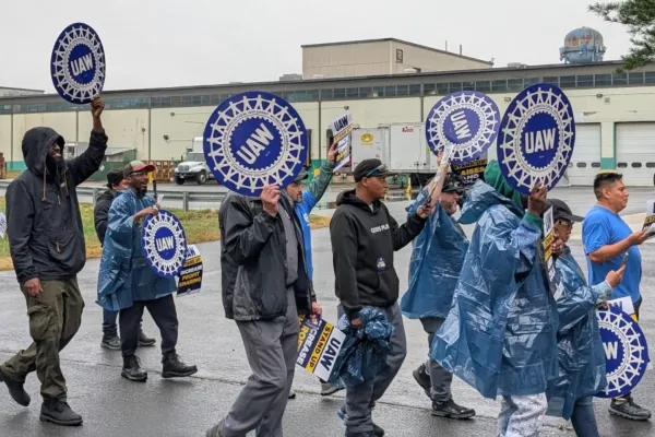Local 379 members practice picketing in the rain