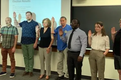 This photo from June 2022 shows the swearing-in of new and returning officers following the results of the L.2324 triennial election. From left to right: Harry Falconer (steward), Jesus Maclean (guide), Mike Toda (trustee), Zachary Bos (president), Cathy Kupa (financial secretary), Richard Larkin (trustee), Shandell Campbell (vice-president), Elizabeth Taft (recording secretary), Alison Parker (trustee), and Andrew Engel (sergeant-at-arms).