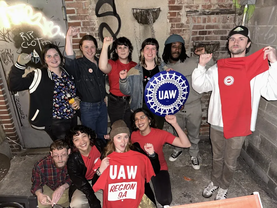 Nitehawk union members with UAW signs