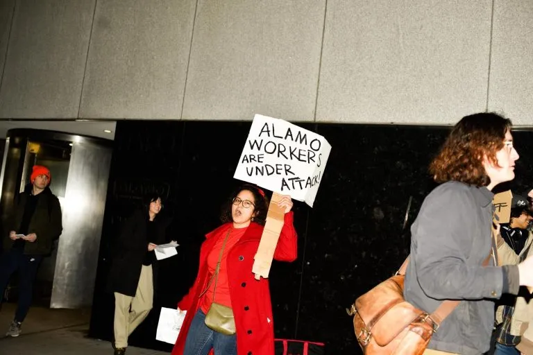 Alamo workers holding an informational picket outside Alamo Drafthouse