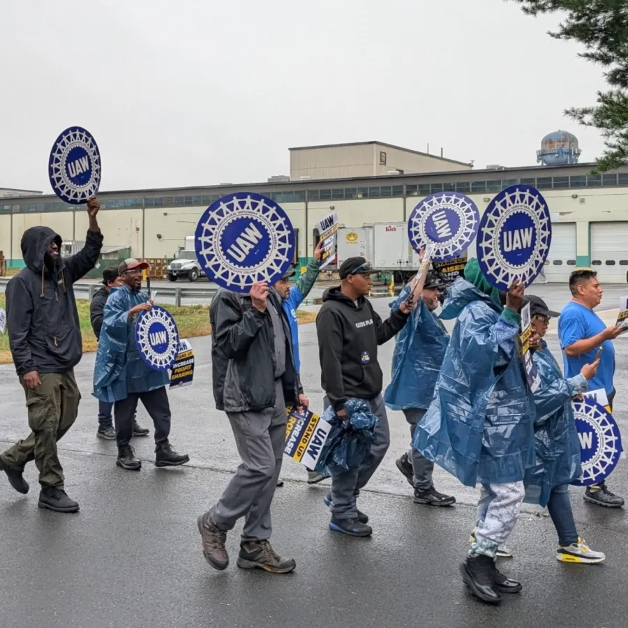 Local 379 members practice picketing in the rain