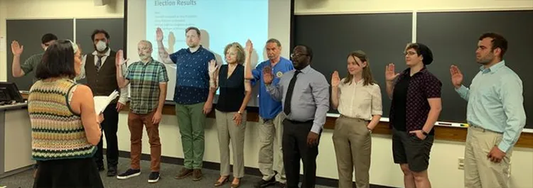 This photo from June 2022 shows the swearing-in of new and returning officers following the results of the L.2324 triennial election. From left to right: Harry Falconer (steward), Jesus Maclean (guide), Mike Toda (trustee), Zachary Bos (president), Cathy Kupa (financial secretary), Richard Larkin (trustee), Shandell Campbell (vice-president), Elizabeth Taft (recording secretary), Alison Parker (trustee), and Andrew Engel (sergeant-at-arms).