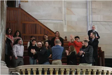 UAW members celebrating passage of bill