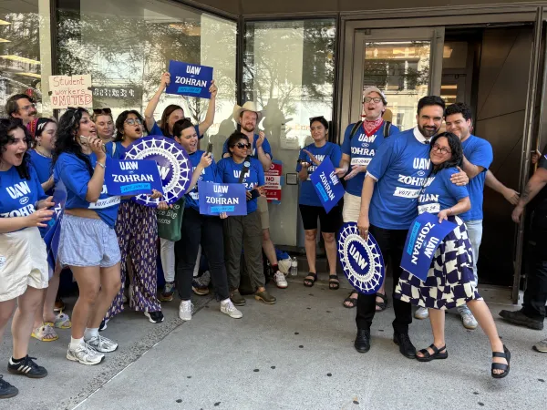 NYC mayoral candidate Zohran Mamdani hugs UAW Local 2110 member & New York Assembly Member Claire Valdez